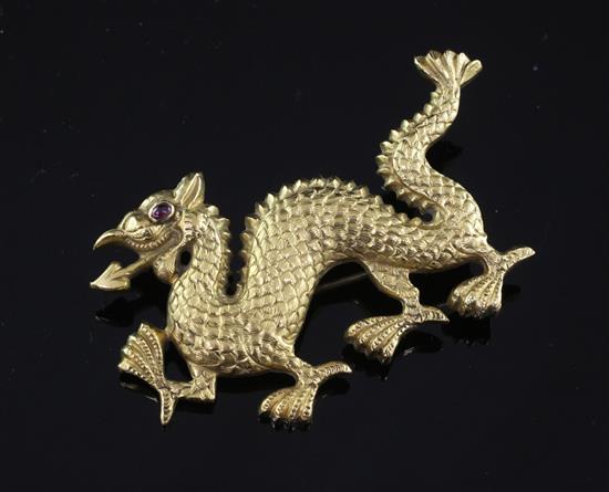 A high carat gold brooch modelled as an Eastern dragon, 2.25in.